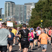 London, UK - October 3, 2021: Lots of people running in London Marathon. People cheering the sportsmen