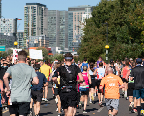 London, UK - October 3, 2021: Lots of people running in London Marathon. People cheering the sportsmen