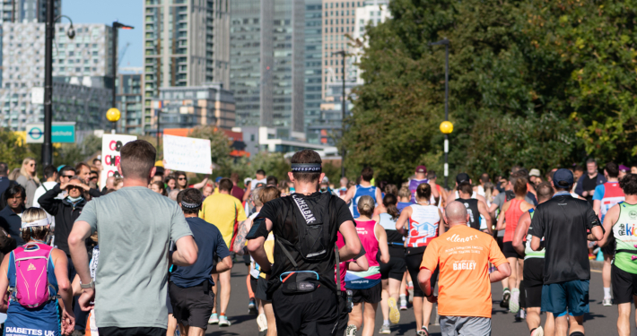 London, UK - October 3, 2021: Lots of people running in London Marathon. People cheering the sportsmen