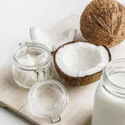 Organic Healthy Coconut Butter And Fresh Coconut Pieces On Woode