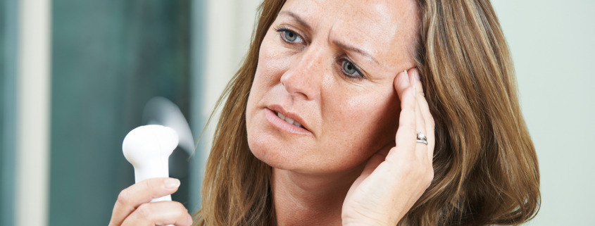 Gamma Knife surgery - Woman Experiencing Hot Flush From Menopause