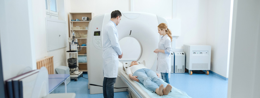 gamma knife surgery - doctors standing over their patient