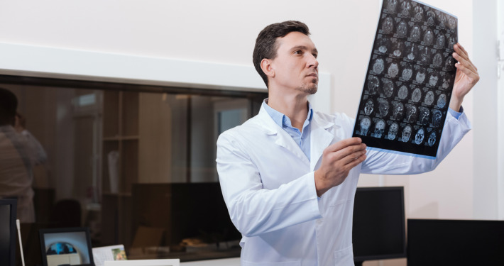 Gamma knife surgery - radiologist looking at CT scan