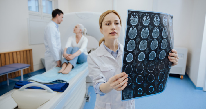 private radiotherapy centres uk - oncologist holding the result of CT scanning