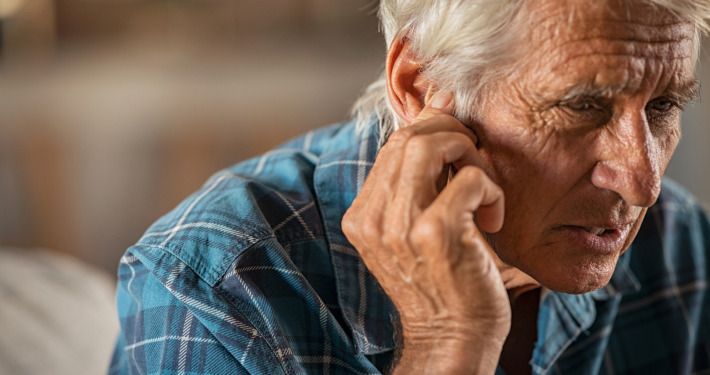 vestibular schwannoma treatment - Senior man holding ears