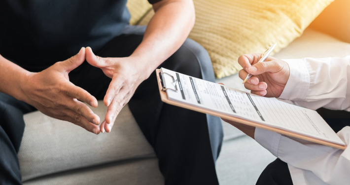 Gamma Knife - Doctor consulting male patient