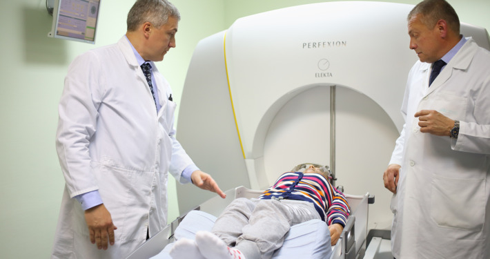 gamma knife surgery - doctors prepares the patient for the procedure on the Gamma Knife