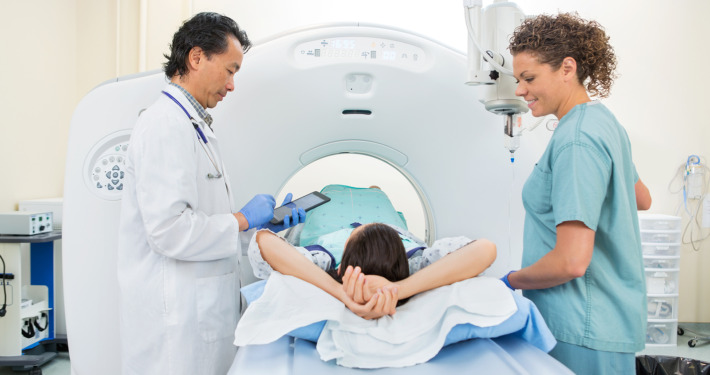 cavernoma treatment - nurse preparing patient for CT scan