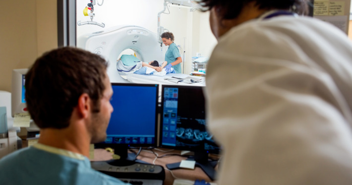 gamma knife surgery - Radiologist and nurse operating computers