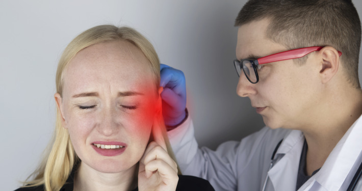rigeminal neuralgia treatment - woman suffers from pain in the ear
