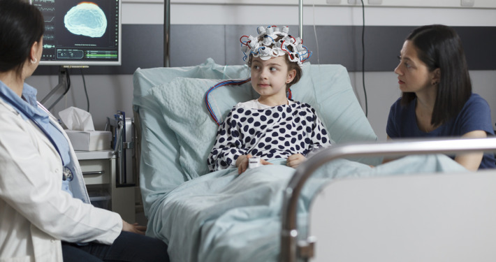 gamma knife radiosurgery - girl wearing EEG headset